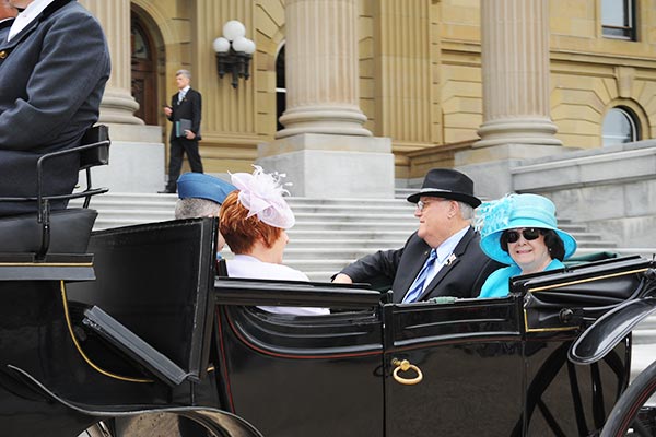 Colonel (Ret&#39;d) the Honourable Donald S. Ethell and Her Honour Mrs. Ethell arrive by horse-drawn carriage.